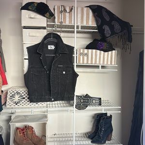 Calvin Klein Vest size MED but fits like a glove, I like nothing under it.